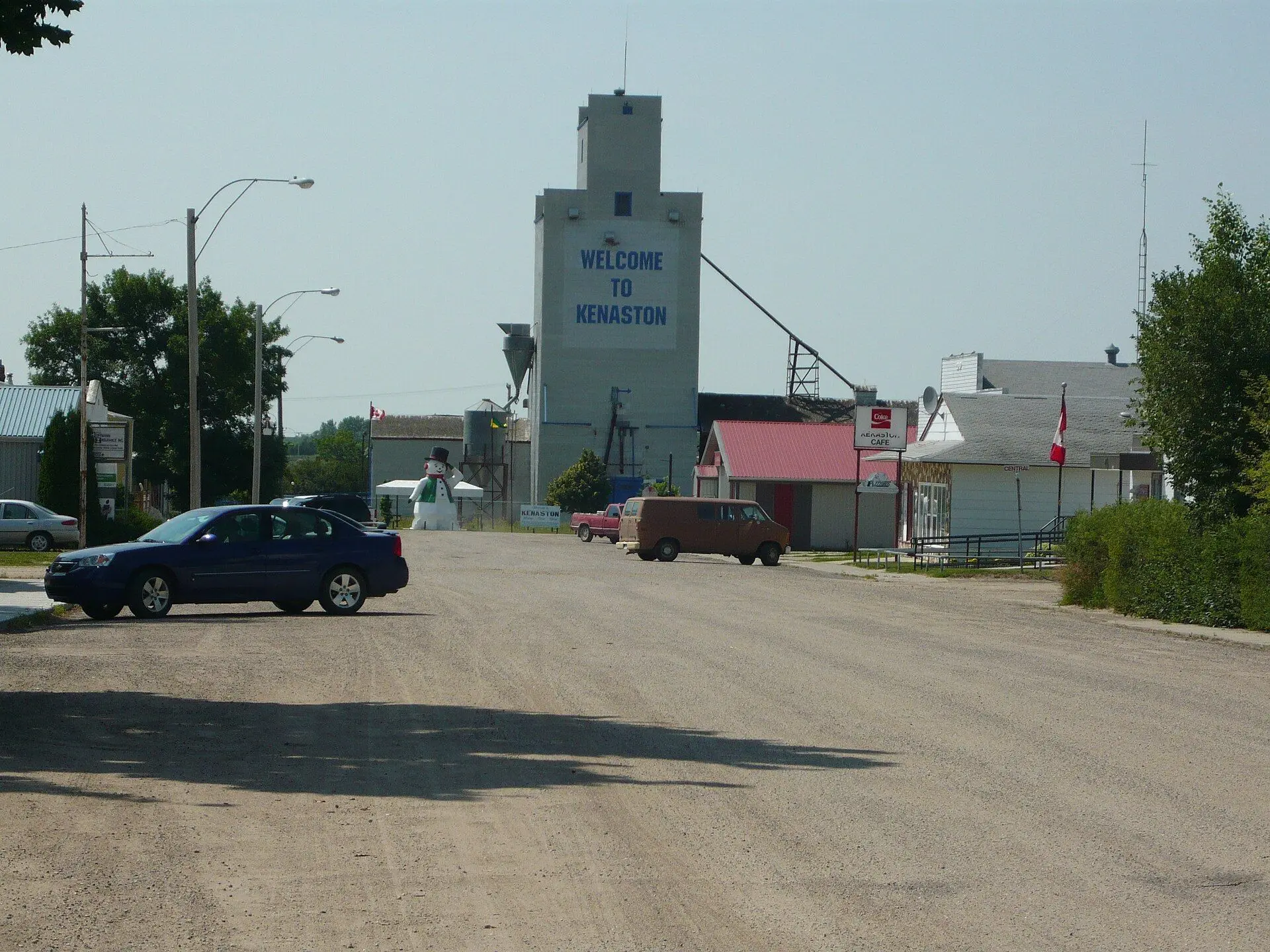 Business district with the "Welcome to Kenaston" grain elevator and giant snowman