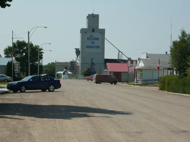 Business district with the "Welcome to Kenaston" grain elevator and giant snowman