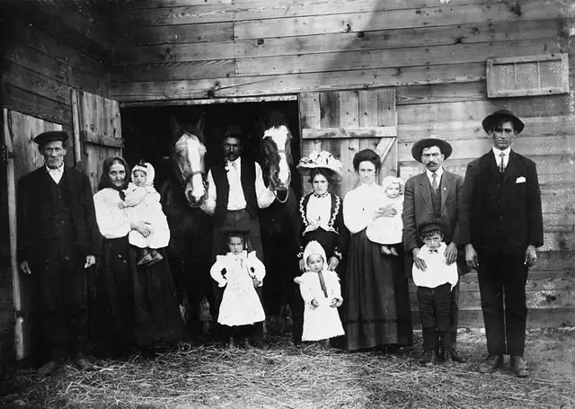 Three generations of Croatian settlers at a barn